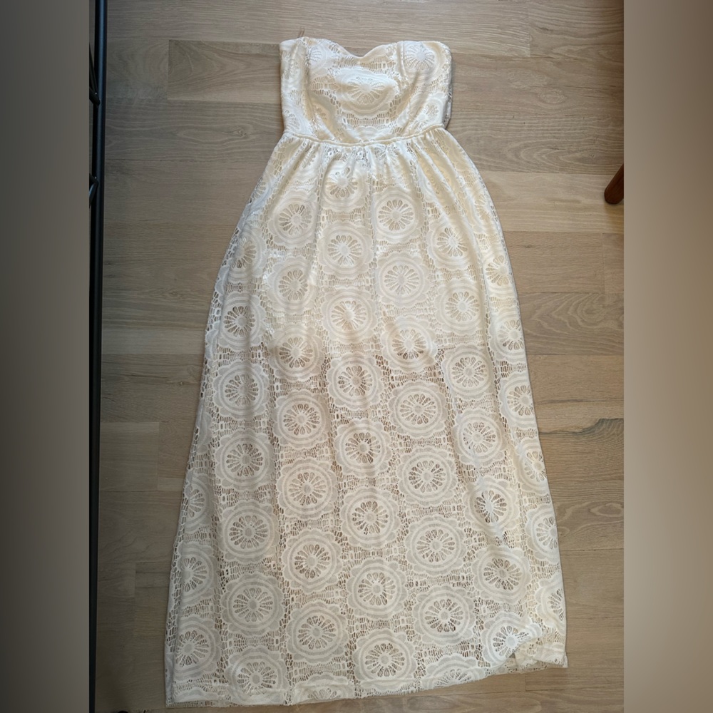 Strapless, floral lace maxi dress with open back detail!